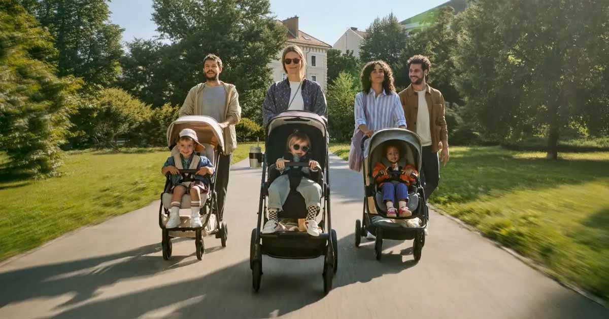 Rodiny s deťmi pri prechádzke v parku, ilustračný obrázok ku kategórii Nuna kočíky